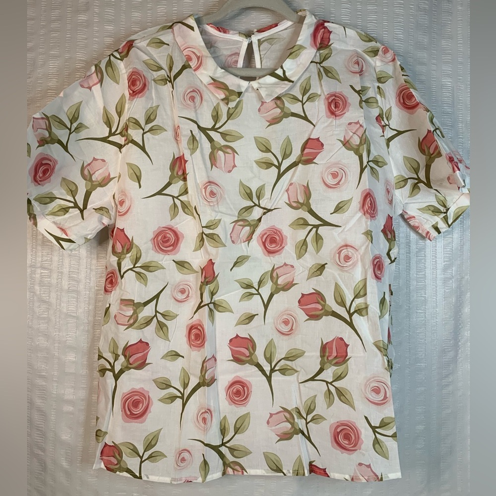 NWOT Women blouse in a pink floral print.